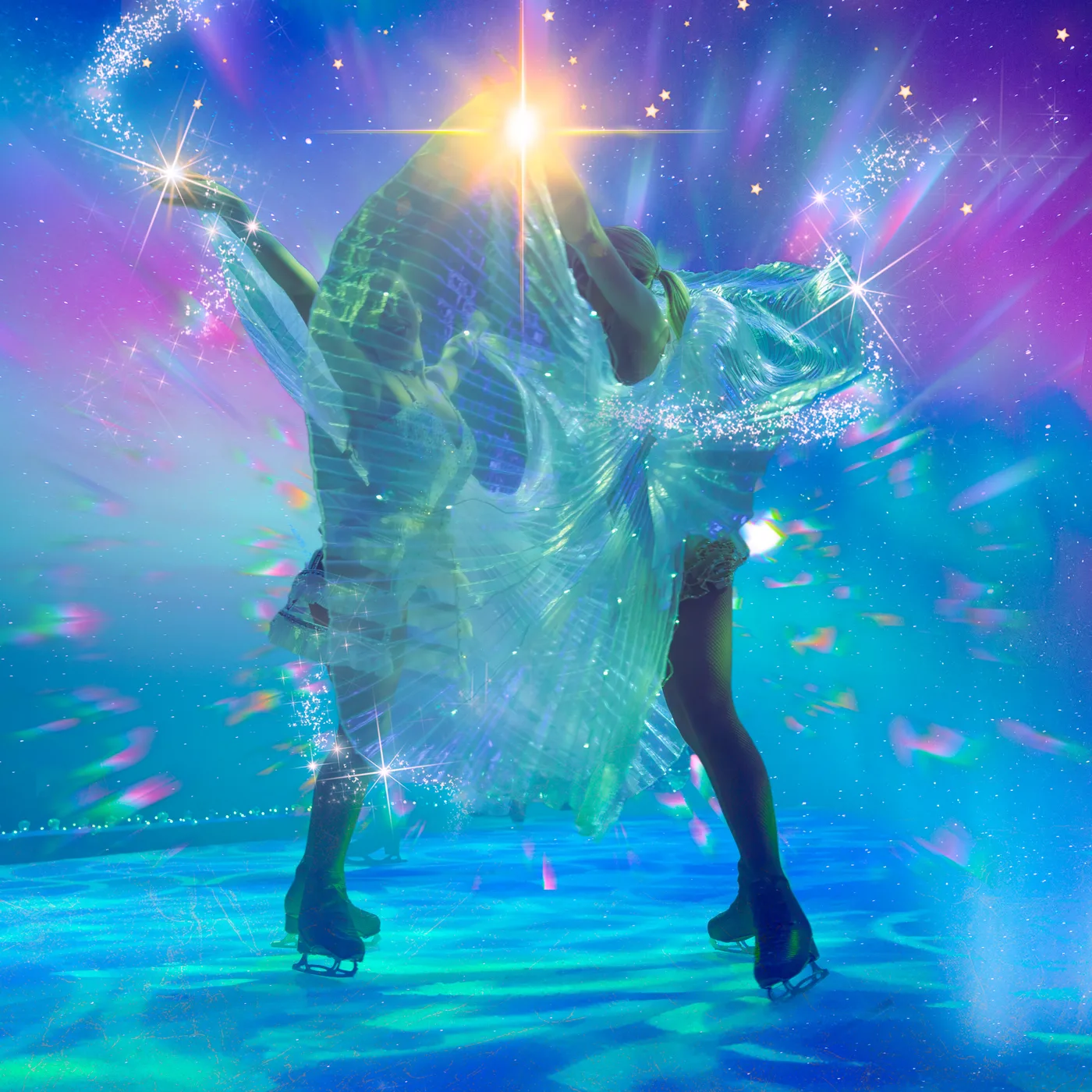 A skater in a flowing green costume on a green and blue lit rink